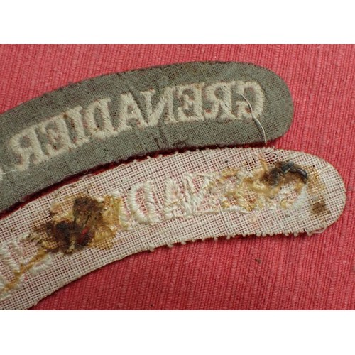 14 - WW2 British Grenadier Guards titles

Near-matching pair, 134 mm across.