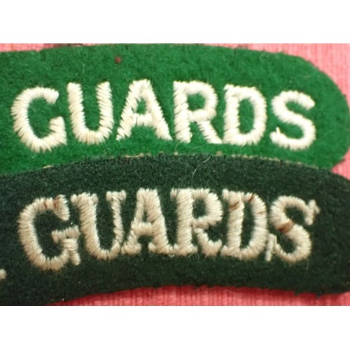 15 - WW2 British Irish Guards titles

Not an exact pair; one is 111 mm across, the other, 100 mm.