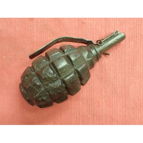 26 - Inert WW2 Russian F1 handgrenade

Battlefield recovered inert grenade. The top still unscrews with e... 