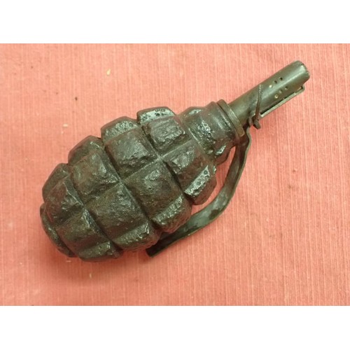 26 - Inert WW2 Russian F1 handgrenade

Battlefield recovered inert grenade. The top still unscrews with e... 