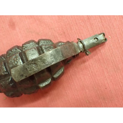 26 - Inert WW2 Russian F1 handgrenade

Battlefield recovered inert grenade. The top still unscrews with e... 
