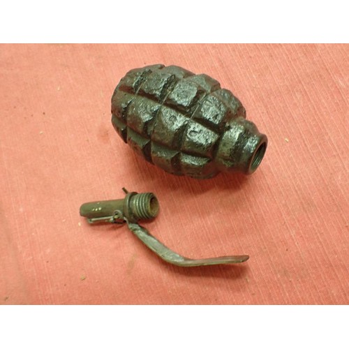 26 - Inert WW2 Russian F1 handgrenade

Battlefield recovered inert grenade. The top still unscrews with e... 