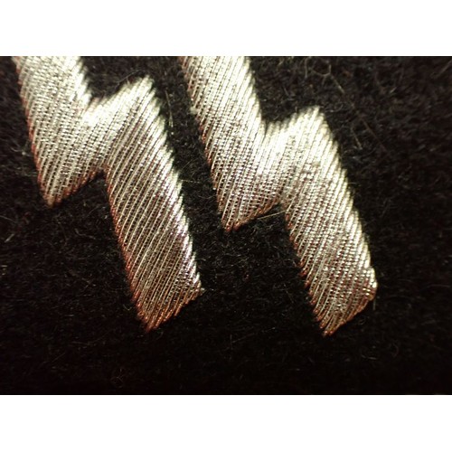 31 - WW2 German Waffen-SS officers' collar tab

One of the under-folds is loose, as is some of the wirewo... 