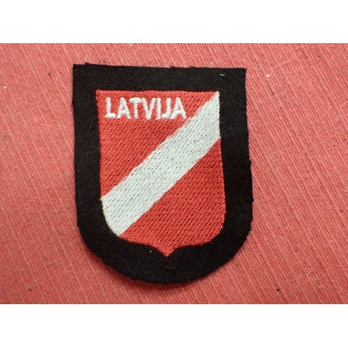 40 - WW2 German Waffen-SS Latvian volunteer div patch

Stitched shield on black woollen backing. Very goo... 