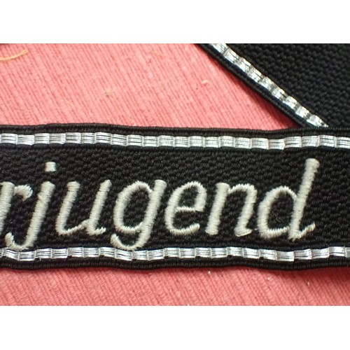 41 - WW2 German Waffen-SS Hitlerjugend cuff title

Traces of its paper RZM label to the back. 450 mm long... 