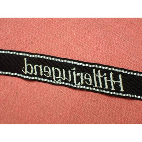 41 - WW2 German Waffen-SS Hitlerjugend cuff title

Traces of its paper RZM label to the back. 450 mm long... 