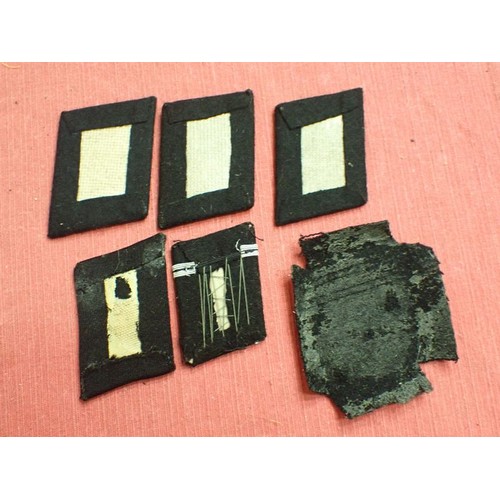 42 - Six WW2 German SS plain side collar tabs.

Three very similar, around 76 mm across. One with a rank ... 