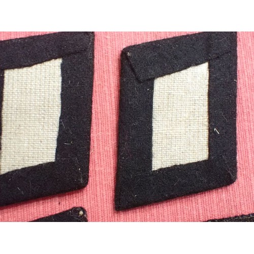 42 - Six WW2 German SS plain side collar tabs.

Three very similar, around 76 mm across. One with a rank ... 