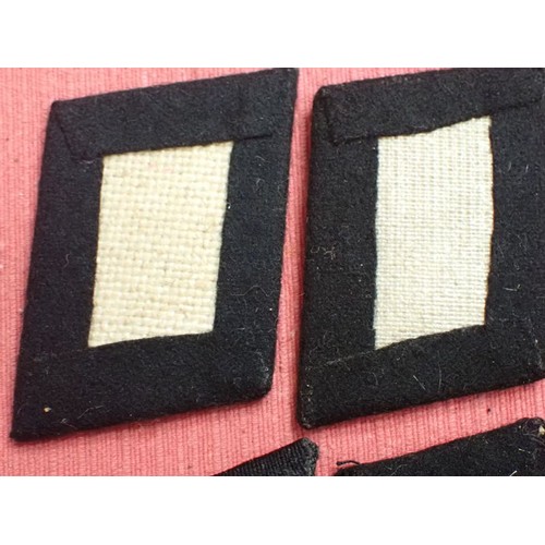 42 - Six WW2 German SS plain side collar tabs.

Three very similar, around 76 mm across. One with a rank ... 