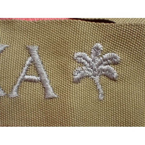 48 - WW2 German army AFRIKA cuff title

Thick grey/blue stitched script. The band is 435 mm long. Very go... 