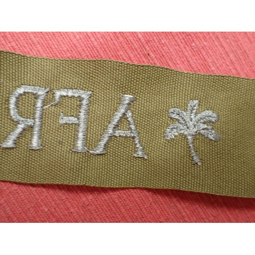 48 - WW2 German army AFRIKA cuff title

Thick grey/blue stitched script. The band is 435 mm long. Very go... 