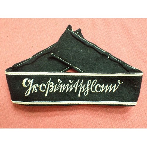 49 - WW2 German army Grossdeutschland cuff title

Stitched white script on a black woollen band. White bo... 