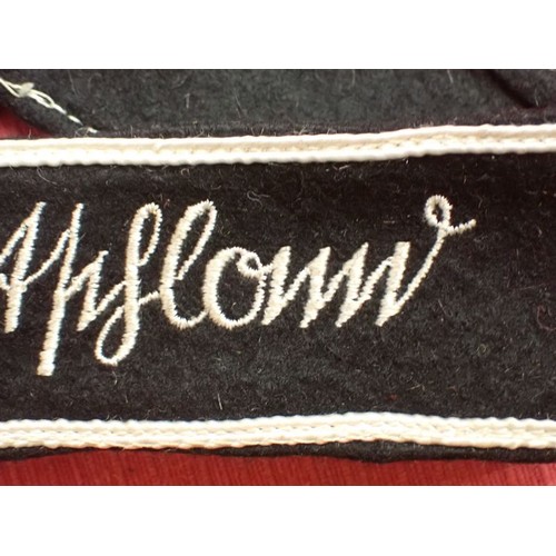 49 - WW2 German army Grossdeutschland cuff title

Stitched white script on a black woollen band. White bo... 