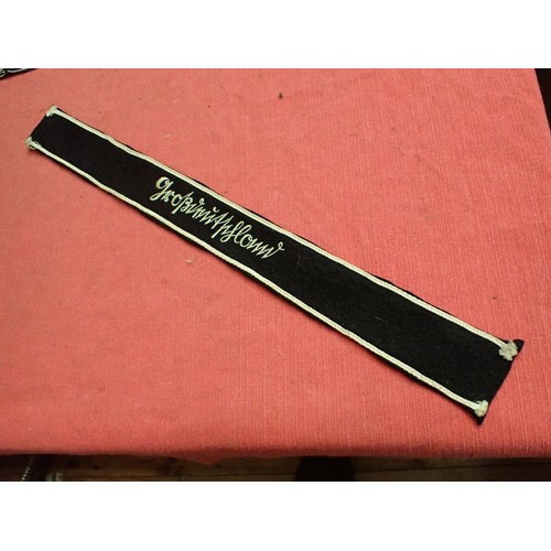 49 - WW2 German army Grossdeutschland cuff title

Stitched white script on a black woollen band. White bo... 