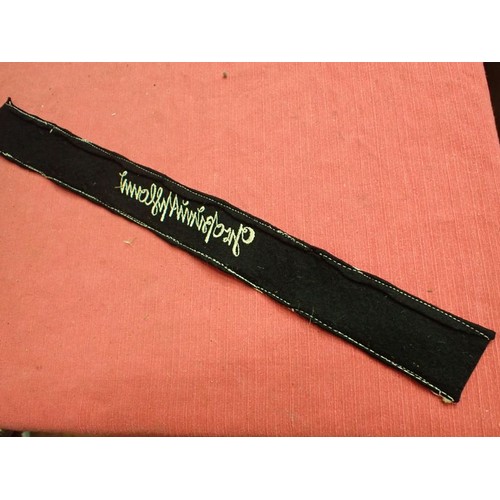 49 - WW2 German army Grossdeutschland cuff title

Stitched white script on a black woollen band. White bo... 