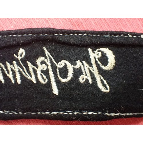 49 - WW2 German army Grossdeutschland cuff title

Stitched white script on a black woollen band. White bo... 