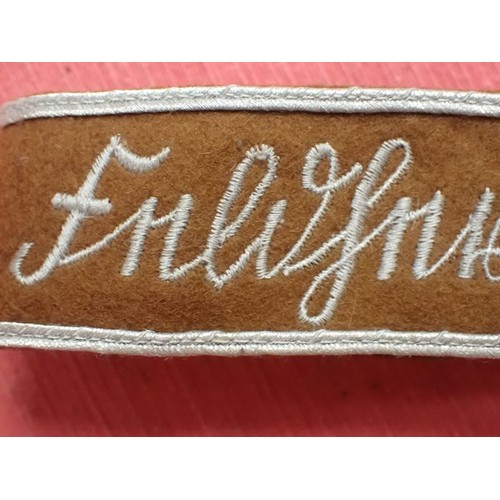 50 - 3rd Reich SA Feldherrnhallen cuff title

Grey stitched script on a brown woollen band. Aluminium wir... 