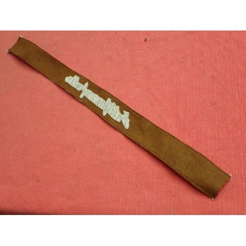 50 - 3rd Reich SA Feldherrnhallen cuff title

Grey stitched script on a brown woollen band. Aluminium wir... 
