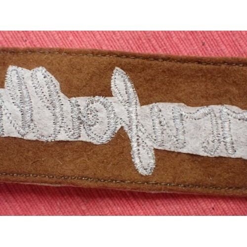 50 - 3rd Reich SA Feldherrnhallen cuff title

Grey stitched script on a brown woollen band. Aluminium wir... 