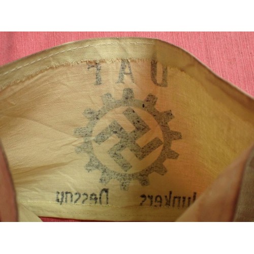 56 - WW2 German DAF armband

Printed armband. The white linen slightly discoloured.