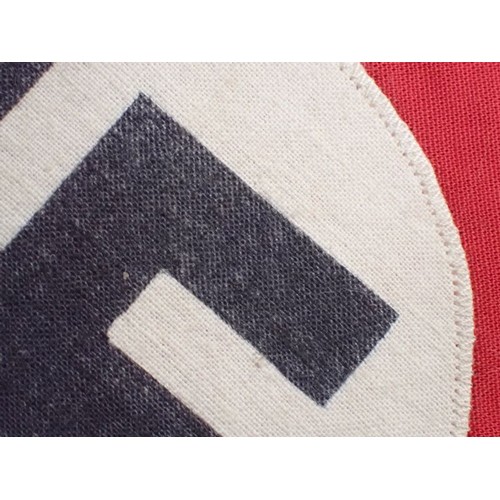 58 - 3rd Reich German NSDAP party armband

Red band with separate roundel and printed swastika. In good, ... 