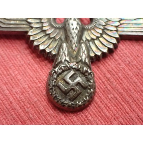 61 - WW2 German SS visor cap eagle

Turned to a dark grey patina. Both fixing pins remain to the back. Wi... 