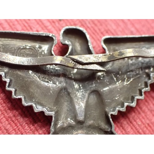 61 - WW2 German SS visor cap eagle

Turned to a dark grey patina. Both fixing pins remain to the back. Wi... 