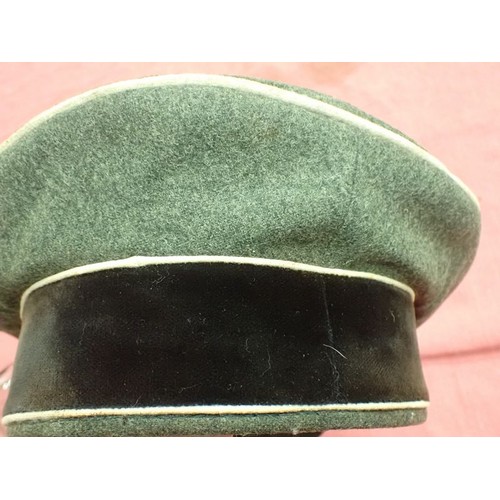 308 - WW2 German Waffen-SS infantry visor cap

Waffen-SS infantryman's visor cap by Erel. No moth nips to ... 