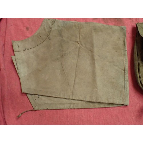 318 - WW2 German breech cover? and a canvas pack

What appears to be a breech cover, possibly for an anti-... 