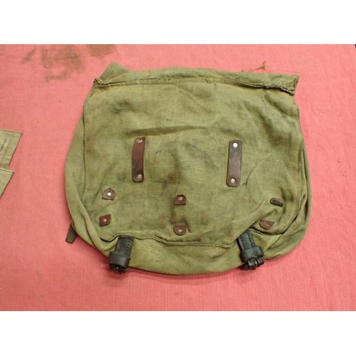 318 - WW2 German breech cover? and a canvas pack

What appears to be a breech cover, possibly for an anti-... 