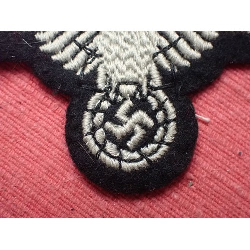 1 - WW2 German Waffen-SS sleeve eagle

Good clean condition. No moth nips to the black woollen backing
