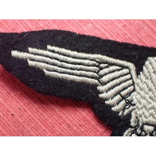 1 - WW2 German Waffen-SS sleeve eagle

Good clean condition. No moth nips to the black woollen backing
