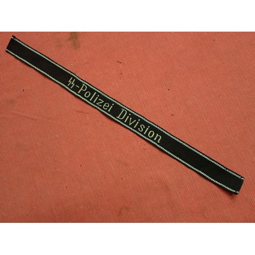 5 - WW2 Waffen-SS-Polizei Division cuff title

455 mm long with folded and stitched ends. Good clean con... 