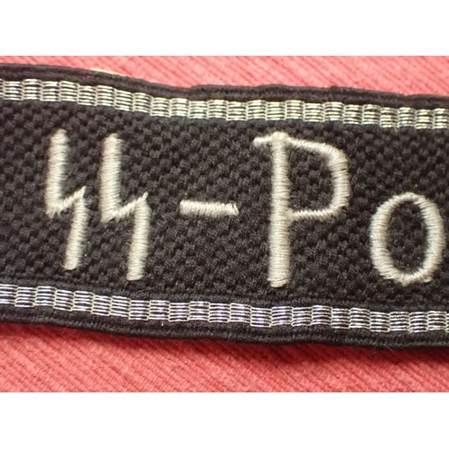 5 - WW2 Waffen-SS-Polizei Division cuff title

455 mm long with folded and stitched ends. Good clean con... 