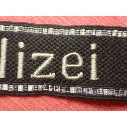 5 - WW2 Waffen-SS-Polizei Division cuff title

455 mm long with folded and stitched ends. Good clean con... 