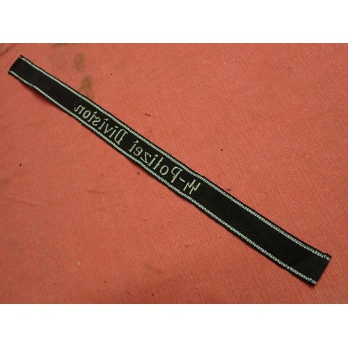 5 - WW2 Waffen-SS-Polizei Division cuff title

455 mm long with folded and stitched ends. Good clean con... 