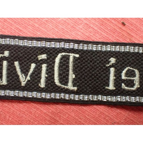 5 - WW2 Waffen-SS-Polizei Division cuff title

455 mm long with folded and stitched ends. Good clean con... 