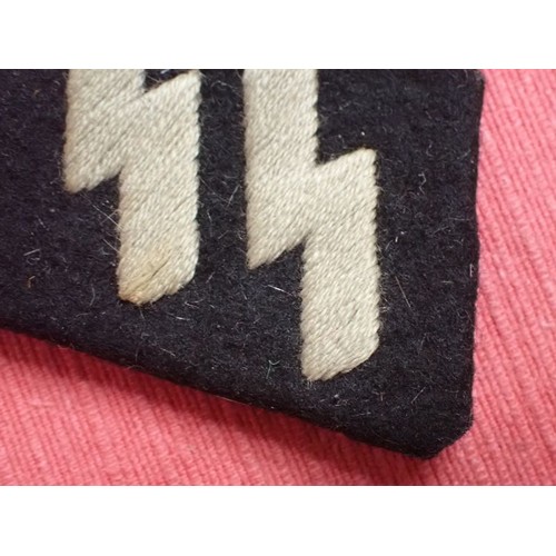 11 - WW2 Waffen-SS runic collar tab

Worn condition with slightly discoloured runes. Two of its flaps ope... 