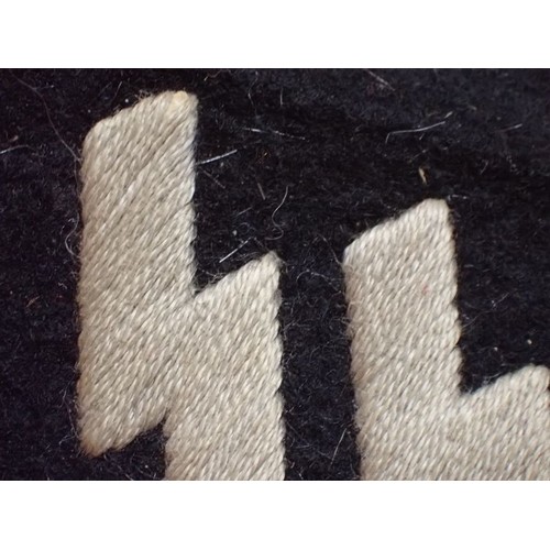 11 - WW2 Waffen-SS runic collar tab

Worn condition with slightly discoloured runes. Two of its flaps ope... 