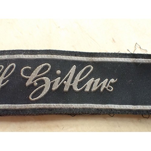 16 - WW2 German Waffen-SS Bevo Adolf hitler cuff title

Tunic removed Bevo title. 418 mm long. Some frayi... 