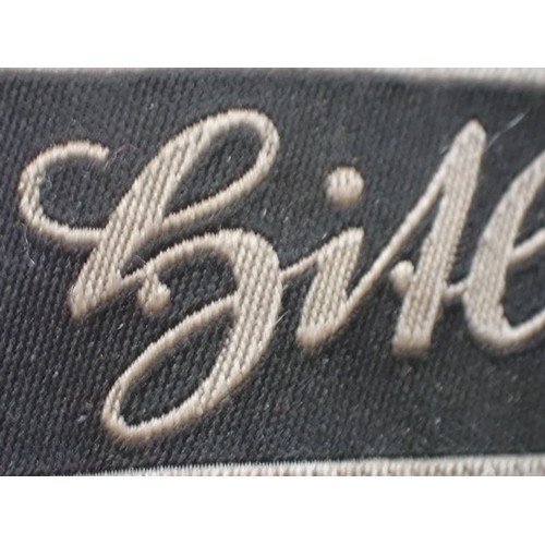 16 - WW2 German Waffen-SS Bevo Adolf hitler cuff title

Tunic removed Bevo title. 418 mm long. Some frayi... 