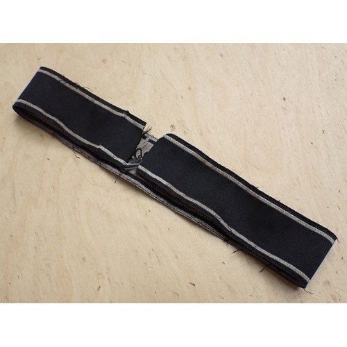 16 - WW2 German Waffen-SS Bevo Adolf hitler cuff title

Tunic removed Bevo title. 418 mm long. Some frayi... 