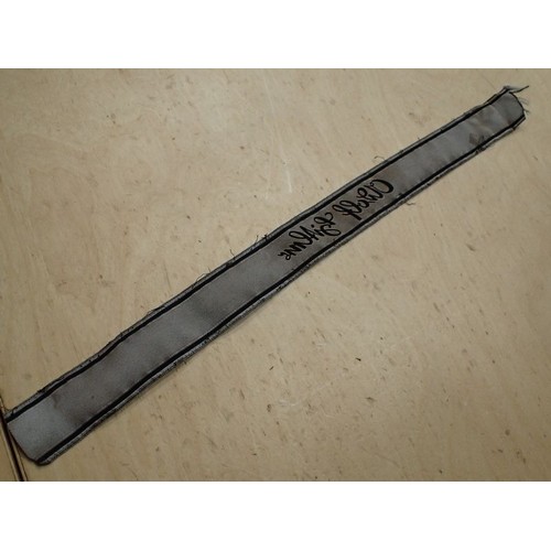 16 - WW2 German Waffen-SS Bevo Adolf hitler cuff title

Tunic removed Bevo title. 418 mm long. Some frayi... 