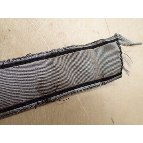 16 - WW2 German Waffen-SS Bevo Adolf hitler cuff title

Tunic removed Bevo title. 418 mm long. Some frayi... 