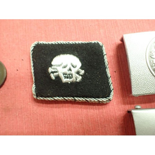 27 - Selection of post war German badges and buckles

Seven reenactment items. The HJ buckle in silvered ... 