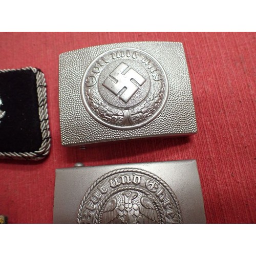 27 - Selection of post war German badges and buckles

Seven reenactment items. The HJ buckle in silvered ... 