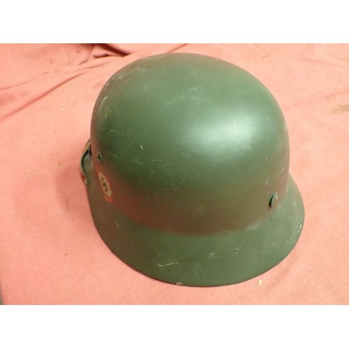 33 - German display / reenactment Waffen-SS M40 helmet

Well done display helmet. The lining appears to b... 