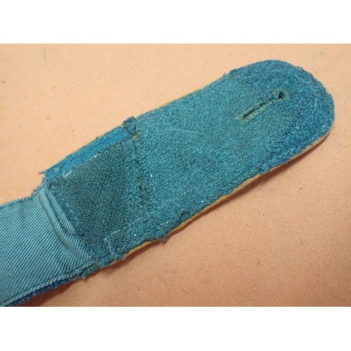 3 - WW2 German field police NCO shoulder strap

A worn example with a wear hole to the top, and a rip to... 