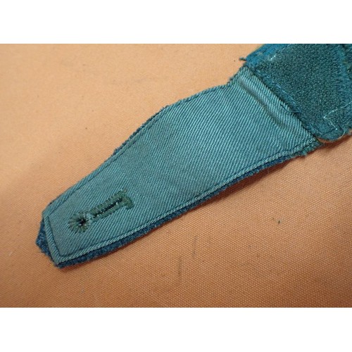 3 - WW2 German field police NCO shoulder strap

A worn example with a wear hole to the top, and a rip to... 