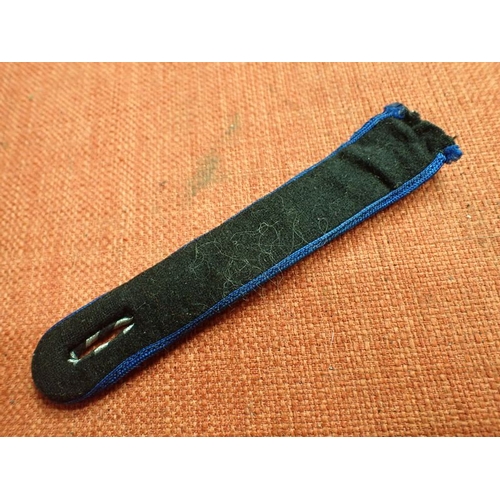 9 - WW2 German SA SHOULDER STRAP

BLUE EDGED STRAP WITH ALUMINUM WIRE TO THE FACING. 125 MM LONG